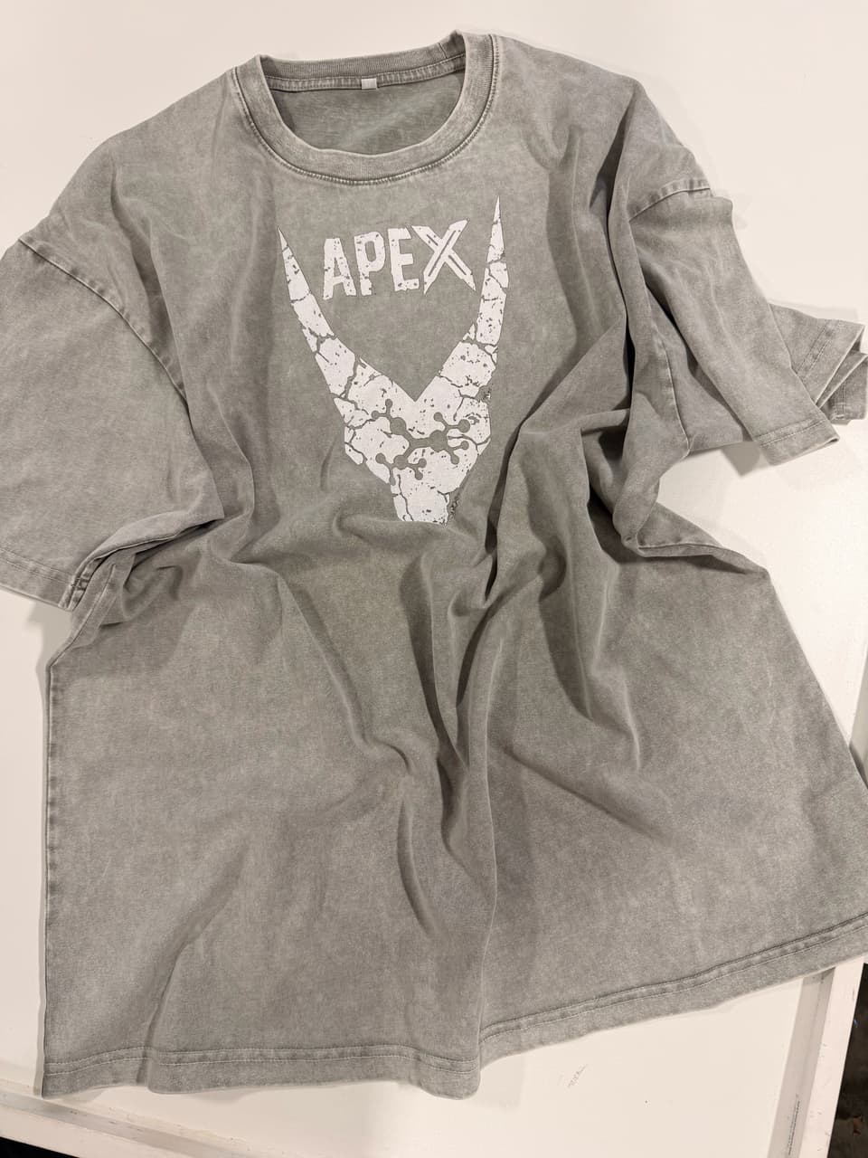 Gray acid-wash T-shirt with a distressed white Apex logo